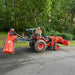 rear angled view of orange MechMaxx 48-inch standard 3 point offset flail ditch bank mower lifted on tractor, gallery position 1