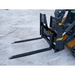 Black painted steel skid steer pallet fork attachment with wide fork tines and reinforced mounting brackets on snow-covered ground