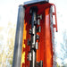 close-up of black flail blades and chain guard inside orange MechMaxx 72-inch ditch bank mower at gallery position 1