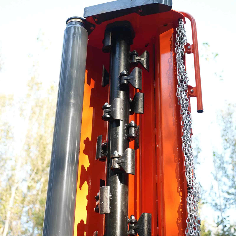 close-up of black flail blades and chain guard inside orange MechMaxx 72-inch ditch bank mower at gallery position 1