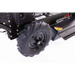 Close-up of rear traction tire and mower deck on Swisher 24-inch walk-behind rough cut mower, gallery position 1
