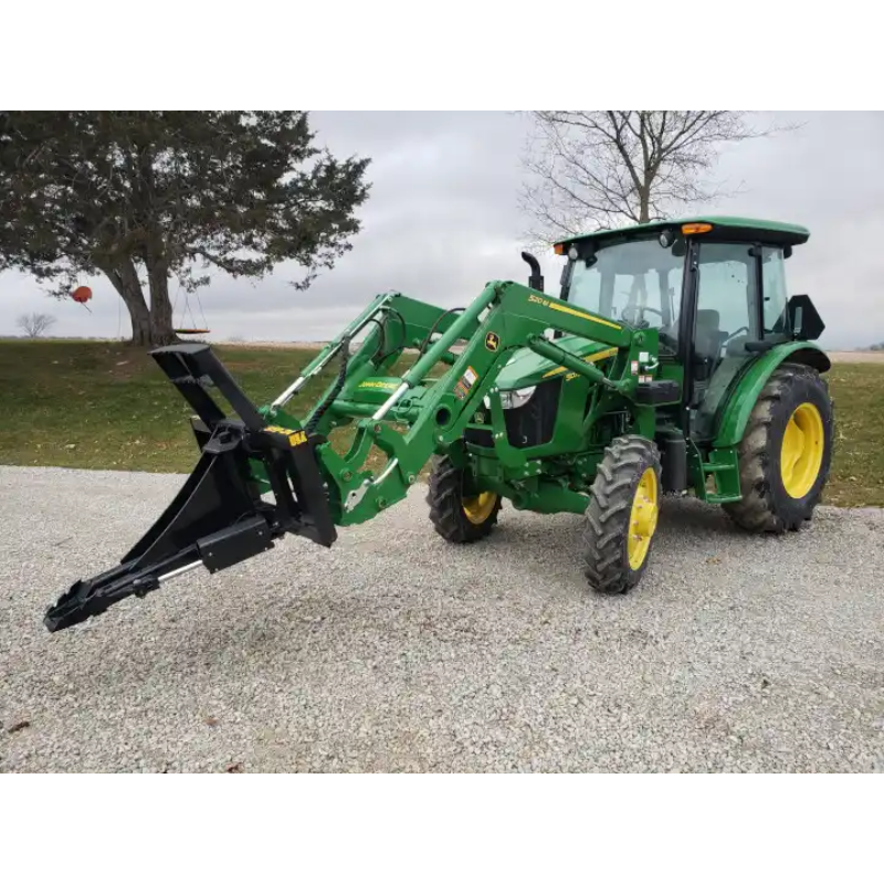 Green tractor equipped with Stinger Attachments STP Tractor Tree Puller shown in square gallery position 9, 800x800 px