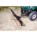 Angle plow attached to green UTV digging into loose soil with red guide markers, gallery position 1