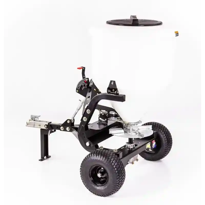 Side perspective of Swisher 52-Gallon Tow-Behind Spreader with white hopper, metal frame, pneumatic tires, and hitch assembly, gallery 1.