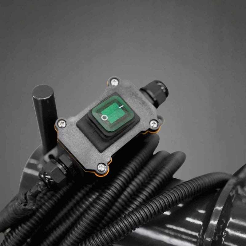 close-up top view of electrical power switch and coiled hydraulic hoses on MechMaxx multi-purpose log grapple at gallery position 1