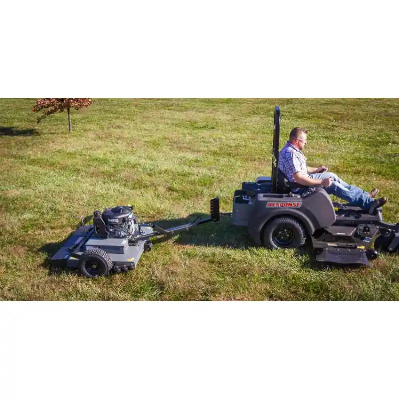 Swisher 44-inch finish cut mower with 11.5HP engine, tow-behind hitch, and operator seated, gallery position 1