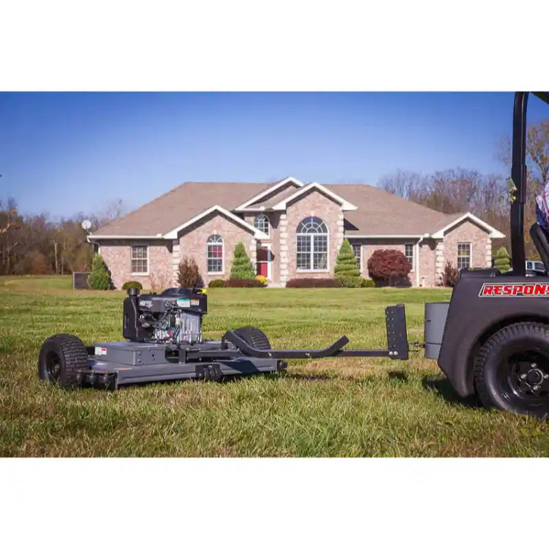 Swisher 44-inch finish cut mower with 11.5HP engine and tow-behind hitch, connected to vehicle, gallery position 1
