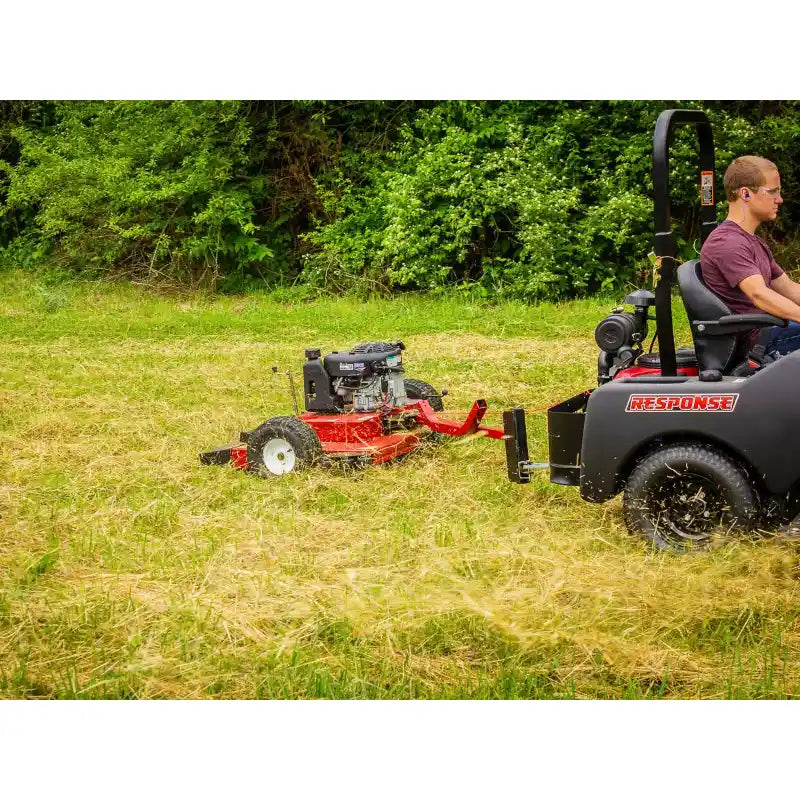 Tow-behind Swisher 44-inch finish cut mower with 11.5HP engine attached to a Response vehicle, gallery position 1