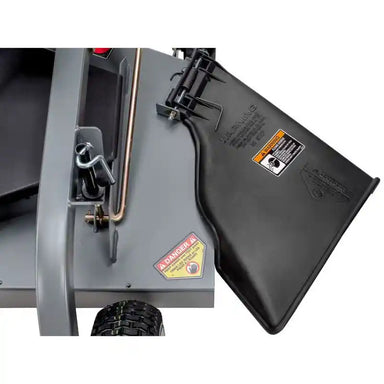 Close-up of discharge chute and safety labels on Swisher 60-inch finish cut mower, gallery position 1