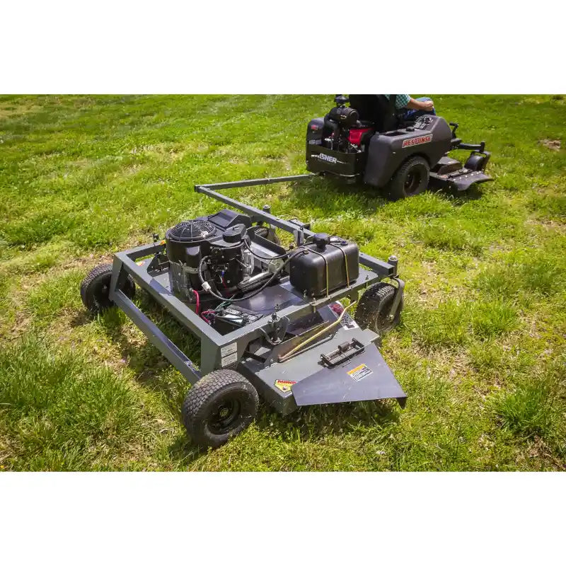 Swisher 66-inch finish cut mower with 14.5HP engine and fuel tank towing behind riding mower, gallery position 1