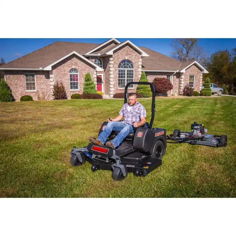 Swisher 44-inch finish cut mower with 11.5HP engine cutting grass in residential lawn, gallery position 1