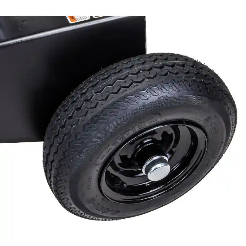 Close-up of tire and black steel wheel assembly on Swisher 34-Ton Timber Brute 14.5 HP log splitter, gallery position 1