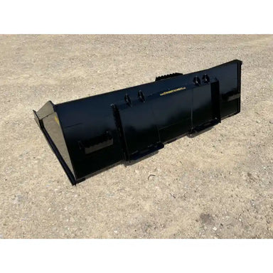 Back and left side view of black steel skid steer material bucket with reinforced mounting brackets on dirt surface