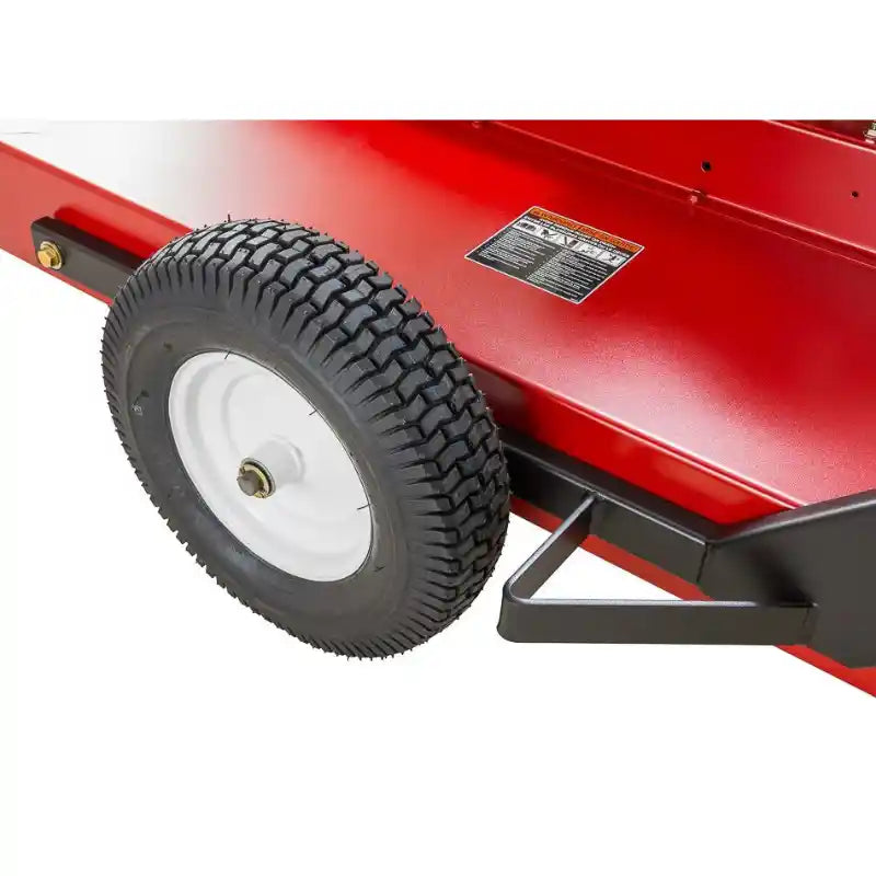 Close-up of rear wheel and red steel deck on Swisher 44" rough cut brush mower, gallery position 1
