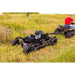 Tow-behind Swisher 44" Brush King mower with 14.5HP Kawasaki engine attached to ATV in field, gallery position 1