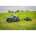 Operator on ATV towing Swisher 44" rough cut mower with 14.5HP engine across grassy field, gallery position 1