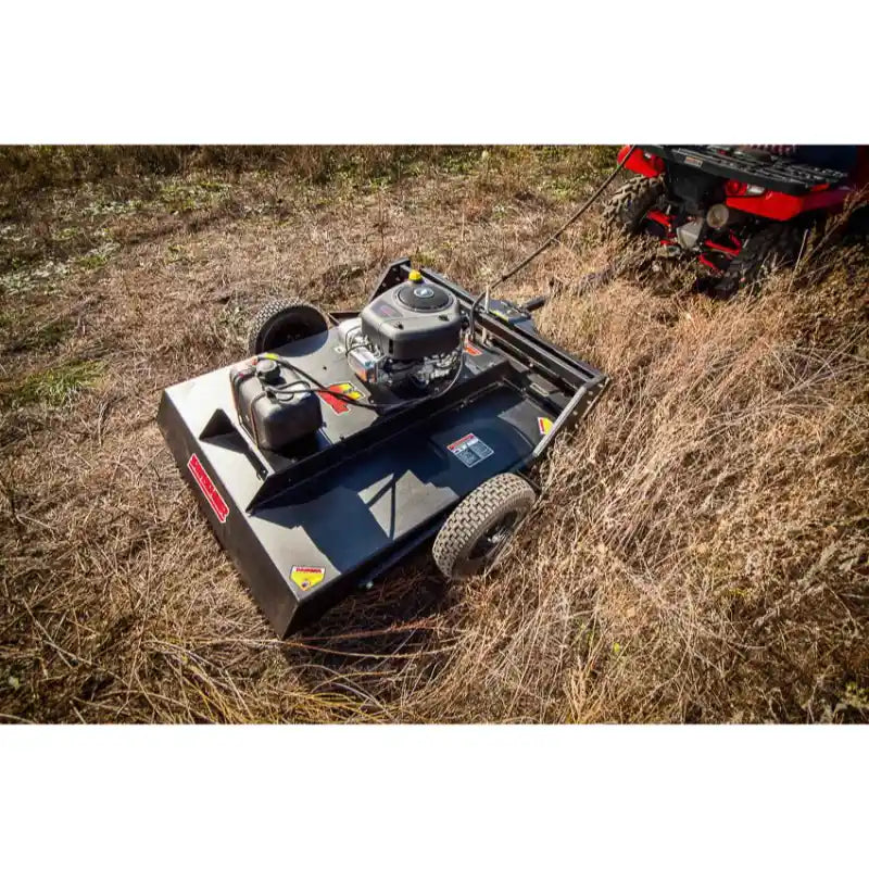 Swisher 44-inch rough cut brush cutter 15.5HP 12V Country Cut tow-behind mower clearing dry grass gallery 1