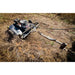 Swisher 44-inch rough cut brush cutter with 15.5HP engine attached via tow hitch, clearing dry brush, gallery position 1 view