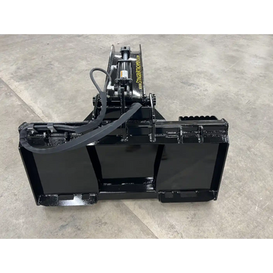 Black metal skid steer stump bucket grapple attachment with dual hydraulic cylinders and reinforced frame on concrete floor