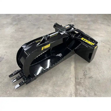 Black steel skid steer stump bucket grapple attachment with hydraulic cylinder and serrated grapple arms on concrete floor