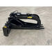 Black skid steer stump bucket grapple attachment with serrated edges, hydraulic cylinder, and three pointed digging teeth on concrete floor