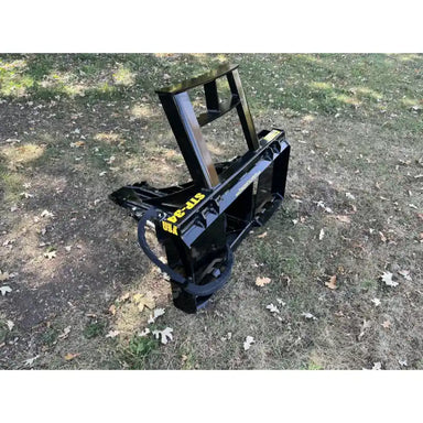 Black steel tractor tree puller attachment with reinforced frame and hydraulic hose on grass with fallen leaves