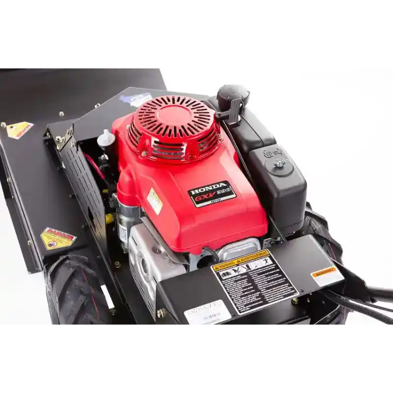 Close-up of Swisher 24-inch walk-behind rough cut mower engine with Honda GXV 10.2HP motor, gallery position 1