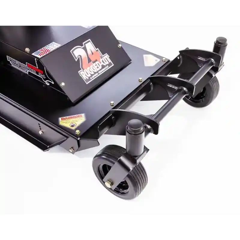 Close-up of front caster wheels and cutting deck on Swisher 24-inch walk-behind rough cut mower, gallery position 1