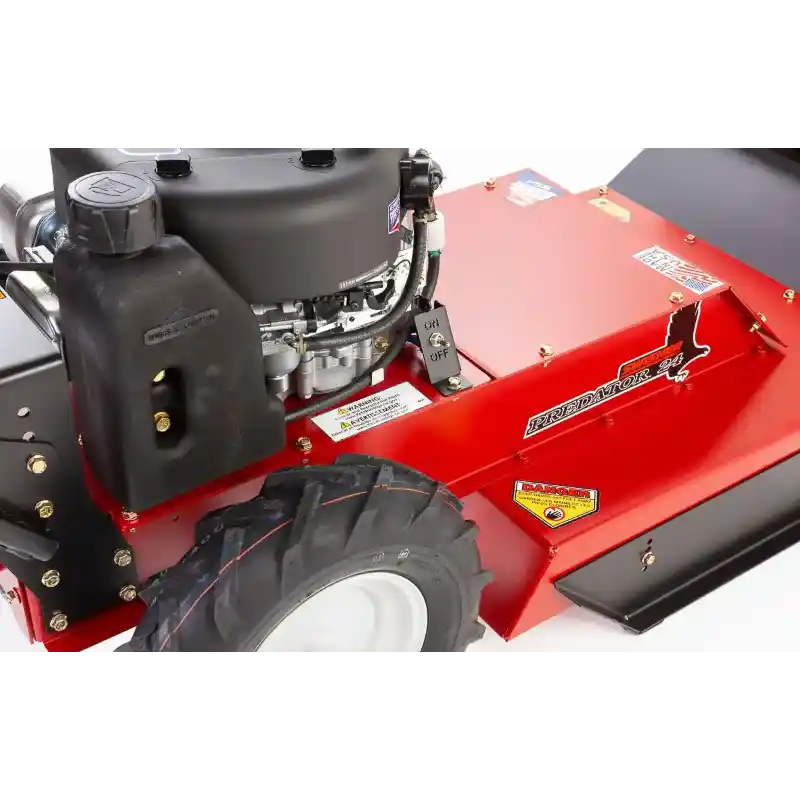 Close-up of engine and rear tire on Swisher 24-inch walk-behind rough cut mower, 11.5HP Briggs & Stratton, gallery position 1