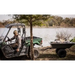 Utility vehicle pulling green Swisher 16 cu ft poly cart loaded with harvested fish, lakeside, gallery position 1