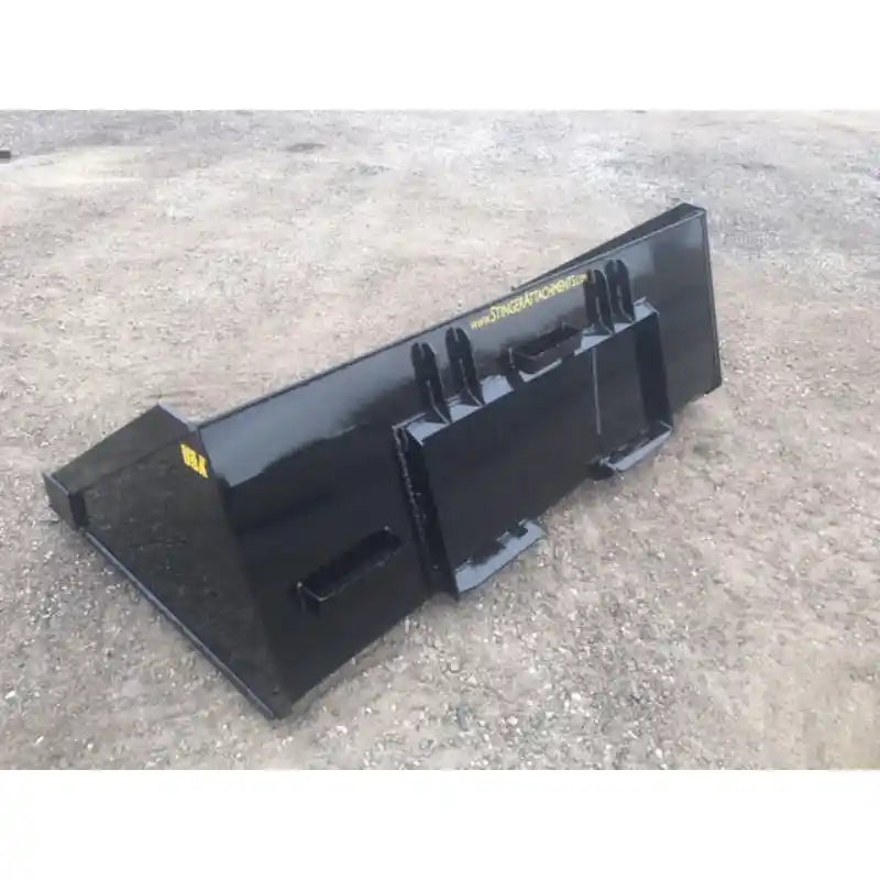 Rear-left angled view of black steel skid steer material bucket with reinforced mounting brackets on compacted dirt surface
