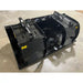 Black steel demolition grapple attachment with dual hydraulic cylinders and open clamp jaws on concrete floor indoors