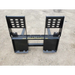 Black painted steel pallet fork attachment with reinforced backrest plates and dual fork tines on dirt surface