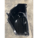 Black steel skid steer concrete bucket with smooth interior and rear mounting brackets on concrete floor