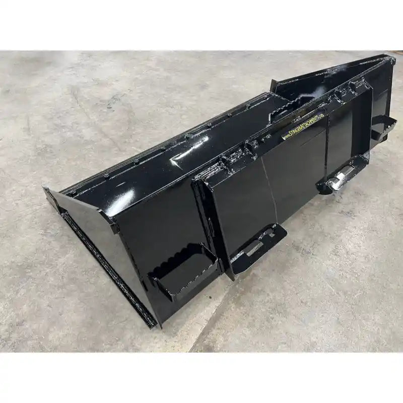Black skid steer material bucket with reinforced back plate, side panels, and step attachment on concrete floor