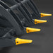 close-up angled view of black mini skid steer timber grab serrated tines with yellow replaceable tips gallery position 1