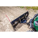 Black 62-inch Swisher angle plow attached to green UTV with springs and red visibility markers, gallery position 1