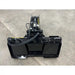 Black steel skid steer stump bucket grapple attachment with hydraulic cylinder and reinforced mounting frame on concrete floor