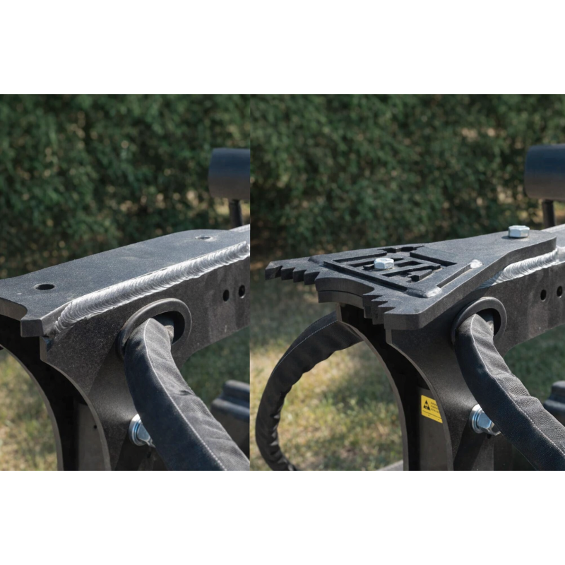 Two black steel skid steer attachment plates side by side, one with a flat cutting edge, one with serrated gripping teeth and bolts
