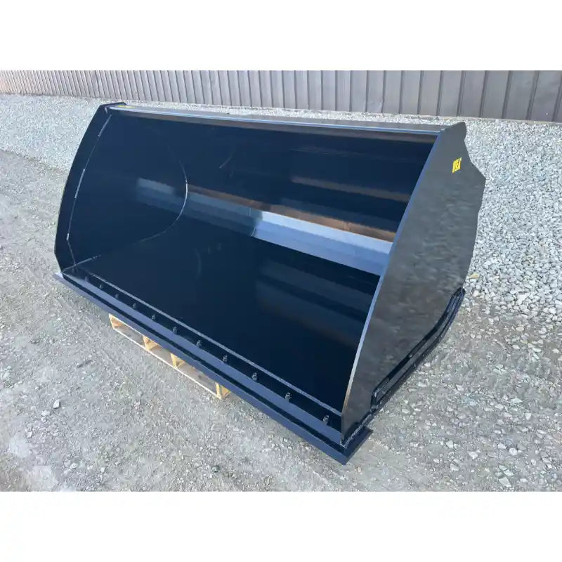 Front-left angled view of a black steel construction bucket attachment with smooth interior and reinforced cutting edge