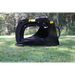 Black skid steer rock grapple attachment with curved tines, hydraulic cylinders, and reinforced frame on grass outdoors