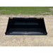 Front view of a black steel skid steer material bucket with smooth interior and yellow Series 3 78 markings on gravel surface