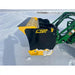 Black and yellow steel snow pusher attachment connected to green loader arm with snow on cutting edge on snowy ground