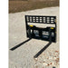 Black steel forklift pallet fork attachment with rectangular perforated backrest and two extended tines on gravel ground