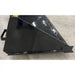Black steel skid steer material bucket with angled side panel and reinforced cutting edge resting on concrete floor