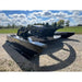 Stinger Attachments TF5 Twister skid steer brush cutter on gravel with blue sky background, gallery image 13, 800x800 square