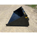 Black skid steer material bucket with smooth interior and angled sides resting on gravel surface