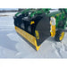 Black and yellow steel snow pusher attachment tipped down, mounted on green compact tractor on snowy field