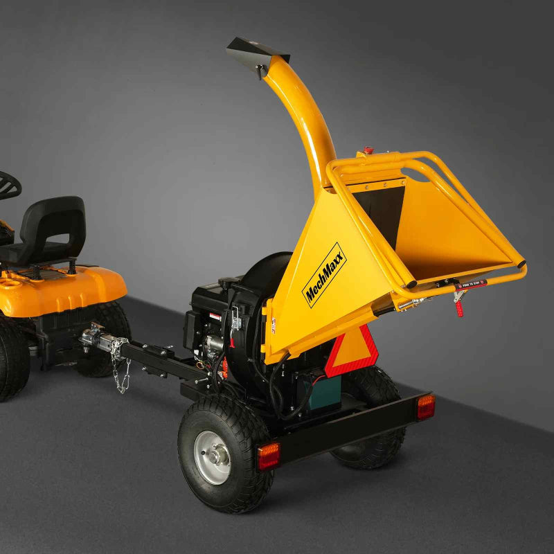 Rear view of MechMaxx 5 inch disc wood chipper with open feed chute, tow bar hitch, and safety triangle gallery position 1