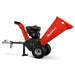 Side profile of red MechMaxx GS650 7hp Ducar wood chipper with towbar and knobby pneumatic tires on white background gallery 1